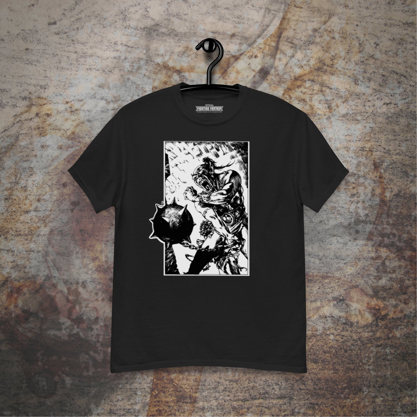 Orc Champion black t-shirt hanging in front of stone wall.